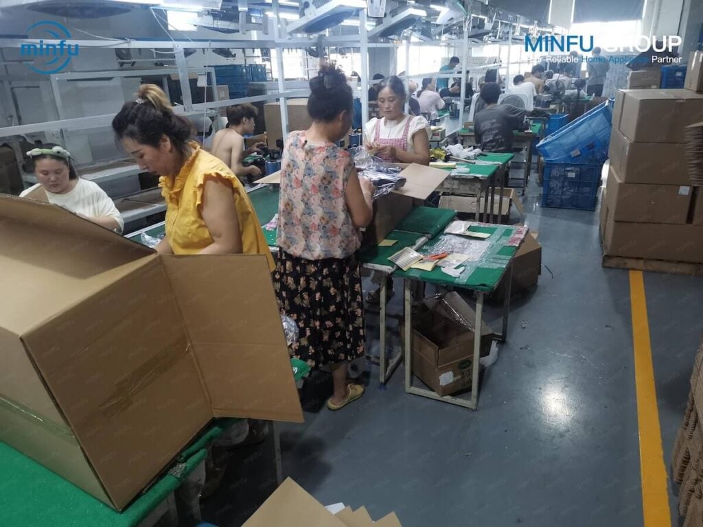 Inside a modern cordless vacuum manufacturing assembly line in China with operators wearing ESD anti-static apparel and wrist straps.