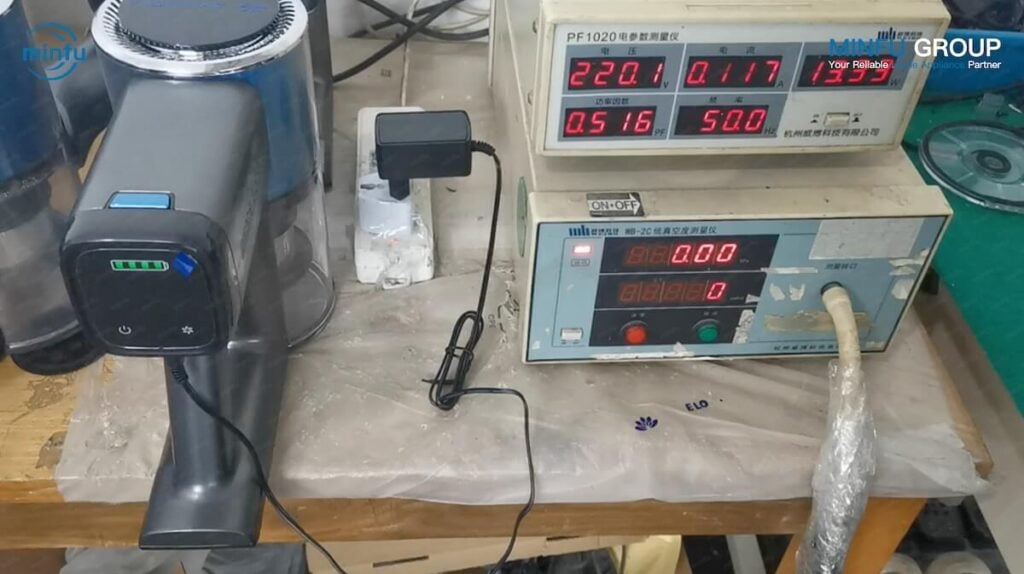 Advanced cordless vacuum reliability testing laboratory featuring robotic carpet wear testing rigs, button fatigue cycle testers, and double-drum drop cabinets.